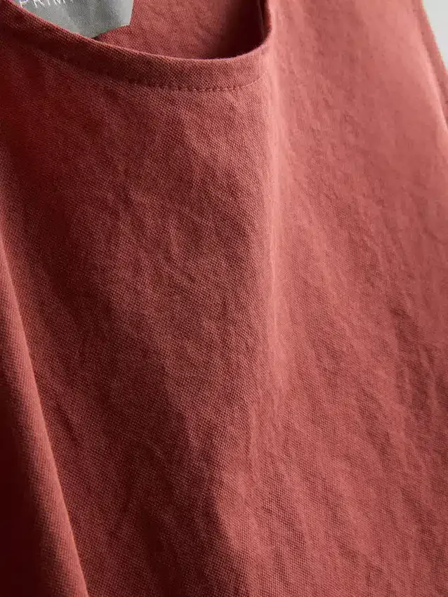 Tanktop met textuur en strik aan de zijkant