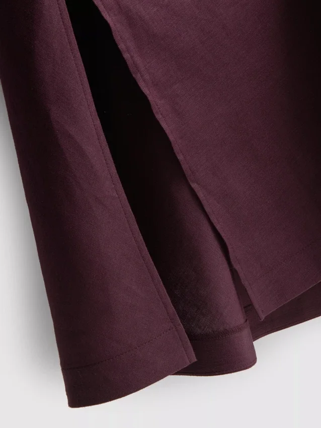 The Edit mouwloze linnen midijurk