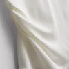 The Edit T-shirt met ruches en asymmetrische snit