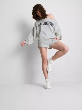 The Primark Scene | Sweatshirt met slogan en blote schouders