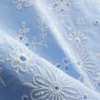 Top met broderie en strik aan de zijkant