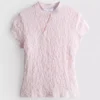 Top met textuur en hoge kraag