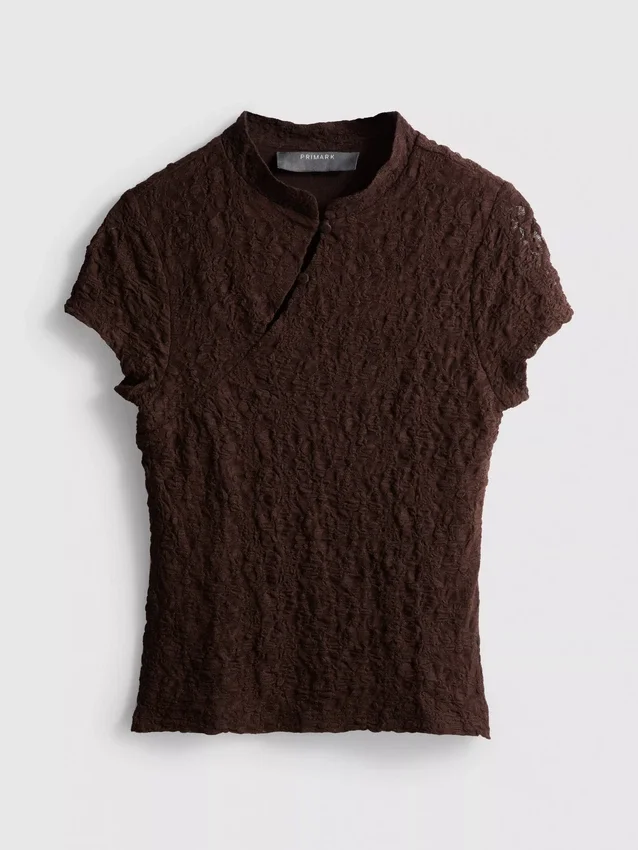 Top met textuur en hoge kraag