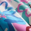 Zwemshort met bloemenprint en graffitidetails